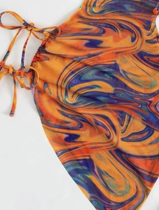 Close-up of marble pattern mesh fabric with side drawstring detail on bikini set