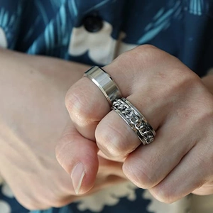 Men's titanium steel ring set featuring a brushed flat band and a spinner cuban chain ring