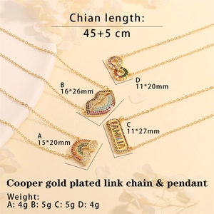 Detail view of gold plated necklaces with rainbow, lips, and infinity zircon pendants