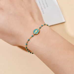 Gold stainless steel bracelet with blue enamel Virgin Mary pendant and turquoise beads