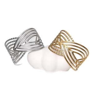 Bracciale rigido aperto geometrico cavo con trama a puntini in finitura oro e argento