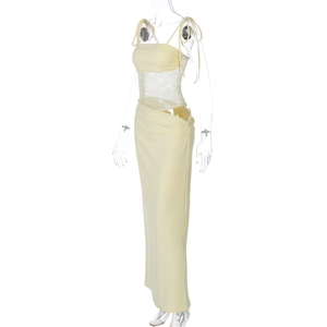 Detail of light yellow dress featuring sheer lace patchwork and slim fit strap design