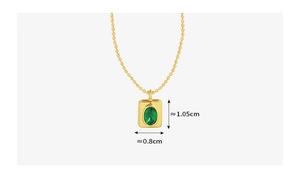 Detail view of gold beaded chain necklace with dimensions of green oval zircon pendant