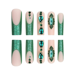 Emerald green French press-on nails with luxury gemstones and glitter on nude base