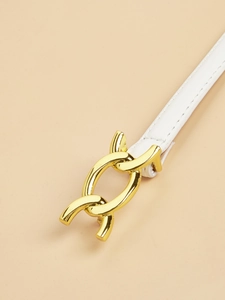 Close-up of a white leather belt with a decorative interlocking gold buckle and stitching