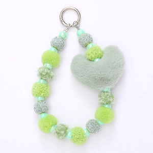 Green plush heart charm with beaded accents and silver keychain for bags and phones