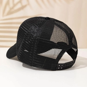 Detail view of black mesh truck hat with adjustable snapback closure and airy design