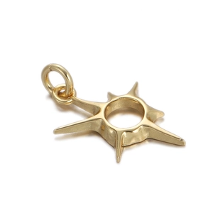 Macro shot of 18K gold plated starburst pendant with polished finish and bail detail