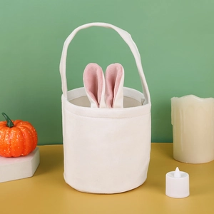 White plush Easter bunny bag with pink ears shown on table with festive props