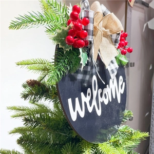 Wooden Christmas welcome door sign with red berries and burlap bow on tree