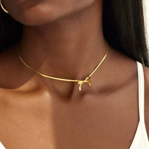Elegant 18K gold plated stainless steel snake chain choker with a delicate bow pendant