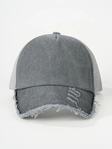 Macro shot of distressed brim and breathable mesh texture on dark gray vintage cap