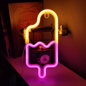 Detail showing an ice cream neon light with yellow and pink glow on a retro background