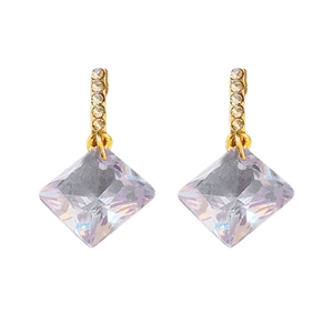 Exquisite gold earrings with sparkling square zircon crystals on a clean white background