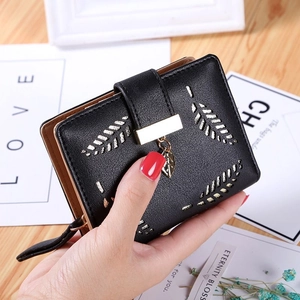 Elegant black faux leather wallet with gold leaf pattern and metal lock closure