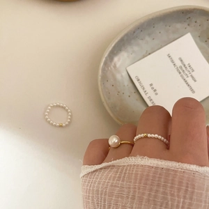 Lustrous freshwater pearl elastic ring set with gold bead accent in stacked style