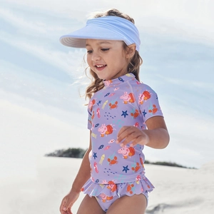Close-up of kids purple two-piece swimsuit set with Peppa Pig print and sun hat