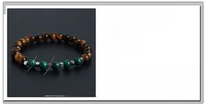 Detail showing malachite and tiger eye beads with stainless steel spacers on elastic cord