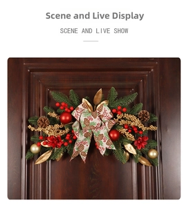 Close-up of Christmas swag with pine cones and red berries on a rustic wooden door