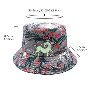 Reversible bucket hat with green unicorn patterns and dimension specs for outdoor wear