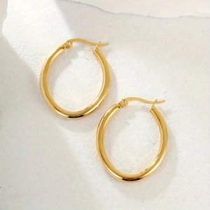 Polished gold stainless steel hollow hoop earrings with secure lever-back closure