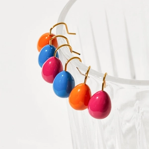 Colorful water-drop enamel earrings in vibrant blue, orange and pink with gold hooks