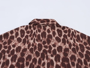 Close-up of the leopard print shirt collar and smooth fabric texture detail