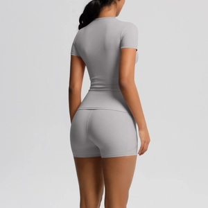 Detailed back view of grey short sleeve yoga set with high waist compression shorts