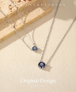 Macro view of S925 silver necklace featuring round royal blue rose cut gemstones