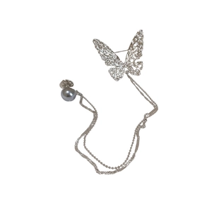 Silver hollow butterfly brooch with long chain and grey pearl accent on white background