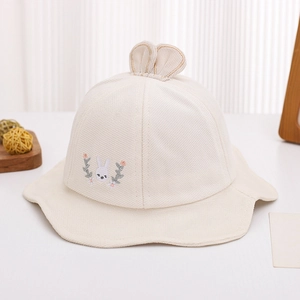 Detail of cream baby sun hat showing corduroy fabric texture and cute rabbit ears