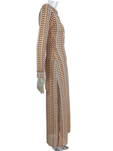 Detail of colorful crochet knit maxi dress with wave pattern and side slit design