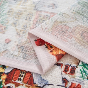 Detailed close-up of Christmas curtain fabric showing rustic linen texture and festive print