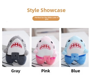 Detailed trio of plush shark keychains in grey, pink, and blue with mini waist bags