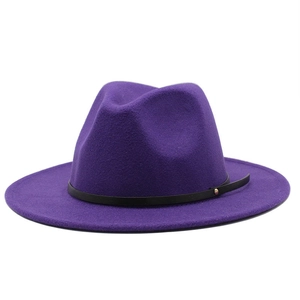 Detailed close-up of a purple wide-brimmed wool fedora with a black leather band and metal stud
