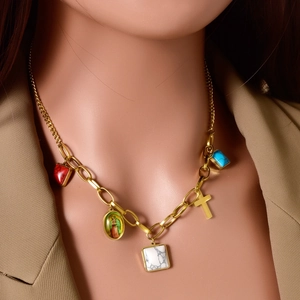 Gold-plated chain necklace with cross, marble cube, and religious icon pendants