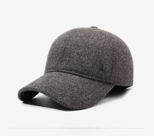 Close-up of winter baseball cap texture with side metal logo and thick wool material
