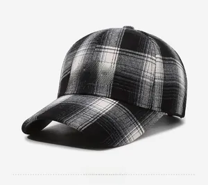 Side view detail of plaid baseball cap with BAHCK embroidery and curved brim design