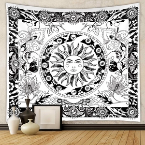 Macro view of Bohemian sun tapestry with zodiac symbols and floral details on wall