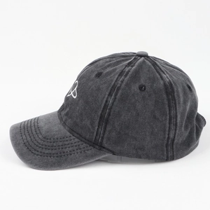 Detail of vintage washed charcoal cotton baseball cap with white geometric side embroidery