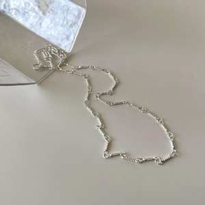 Minimalist 925 sterling silver twisted rope chain necklace on glass display