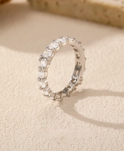 Macro shot of s925 sterling silver eternity ring with full square and round cut diamonds