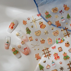 5D embossed Christmas nail art stickers with gold foil trees and cute snowmen patterns