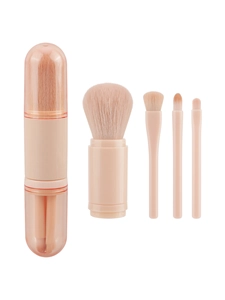 Macro detail of portable 4-in-1 travel makeup brush set in nude pink with transparent lid