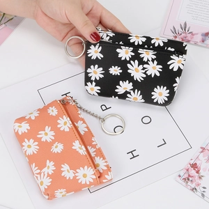 Daisy print mini coin purse with key ring in black and apricot fabric colors