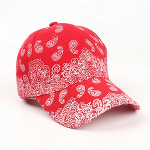 Detailed view of red paisley pattern and texture on a cotton bandana baseball cap