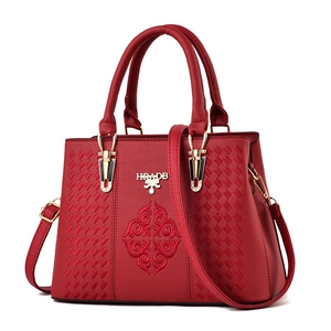 Fashionable red large capacity handbag with flower embroidery and gold tone hardware