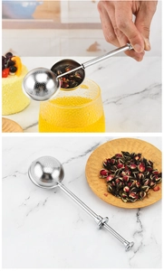 Macro shot of 304 stainless steel tea infuser with retractable long handle and loose leaf tea