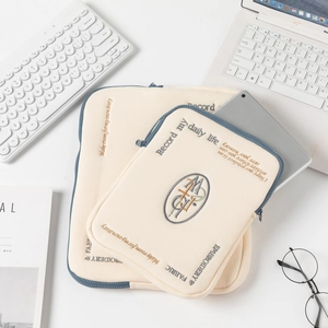 Minimalist beige embroidered laptop sleeve and tablet bag set with navy zippers