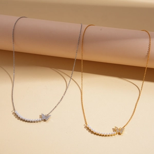 18k gold plated necklace with small pearls and a sparkling zircon butterfly pendant